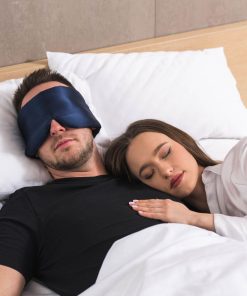 Man and woman peacefully sleeping with deep sleep mask